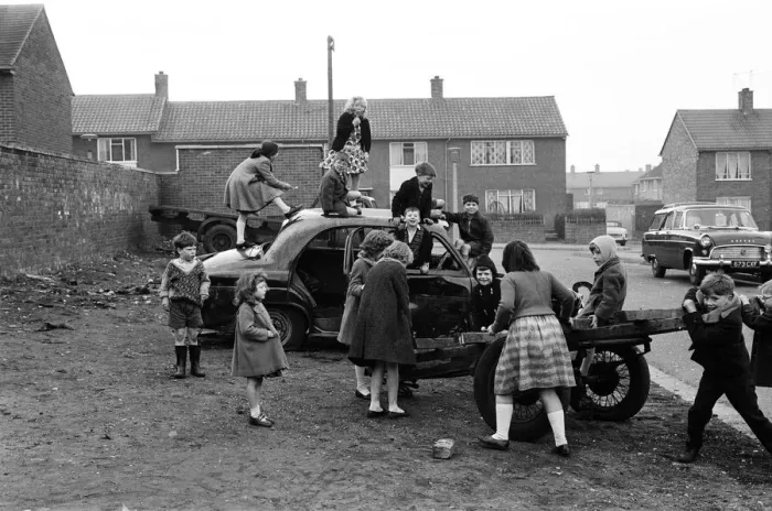 Framed Print : Children play on the wreck of a dumped car at Kirkby, Liverpool. 18th March 1965 Framed Print : Children play on the wreck of a dumped car at Kirkby, Liverpool. 18th March 1965
