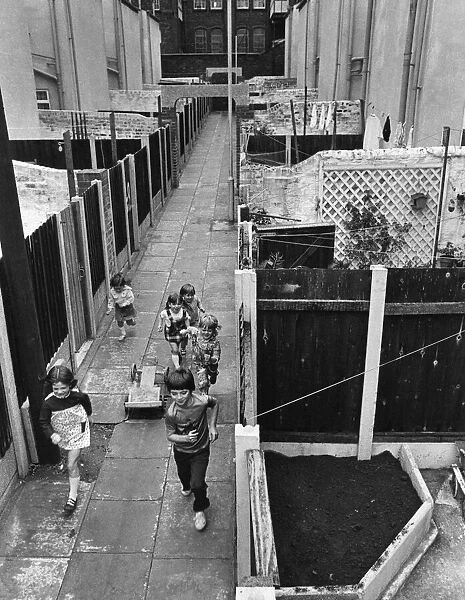Children playing in alleyways of Liverpools Flower Streets, Kirkdale, Liverpool