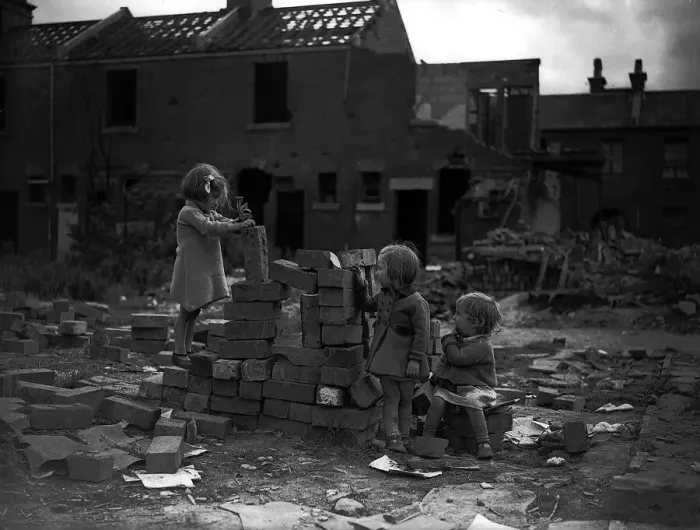 Framed Print : Children playing on bomb site after a bombing raid in London during WW2