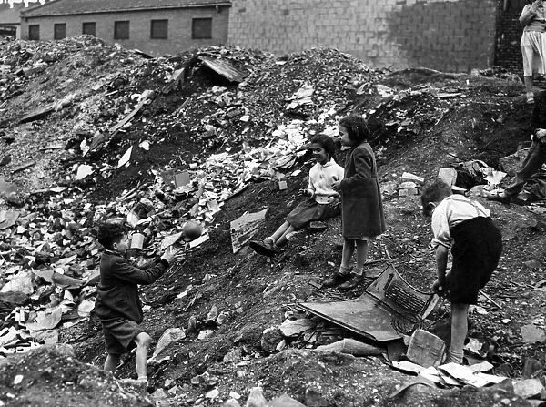 Children playing on a dump near Harrowby Street, Cardiff Docks