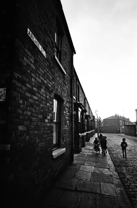 Framed Print : Children playing football in Archie Street, Manchester. Archie Street was the inspiration