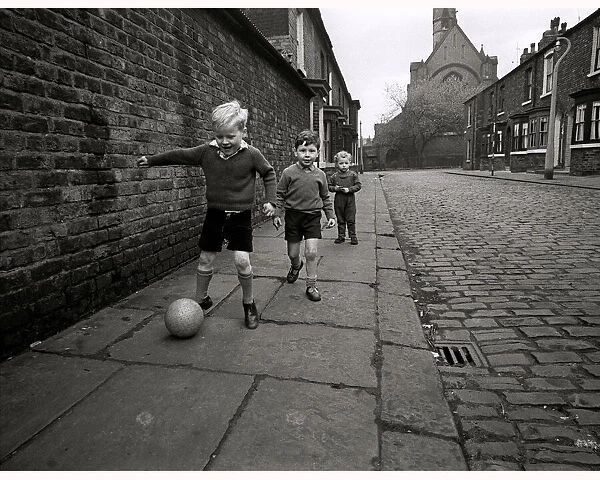 Children playing football on the streets of Manchester in England May 1967