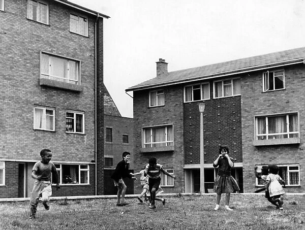 Children playing in Hodges Square, Butetown, Cardiff. 25th August 1961