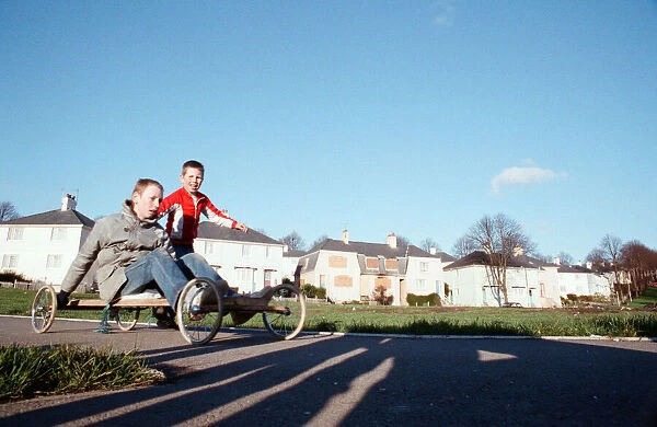 Children playing with a homemade go kart, Plymouth Estate. 22nd November 1988