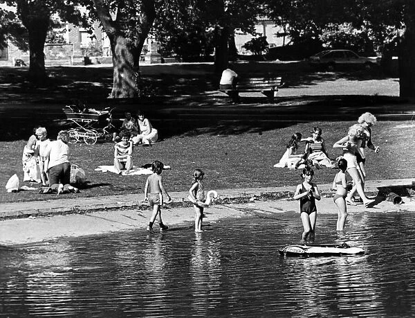 Children playing in the lake at Albert Park, Middlesbrough, North Yorkshire