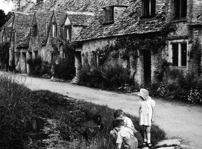 Framed Print : Children playing on the road outside a picturesque row of cottages in Arlington Row in Framed Print : Children playing on the road outside a picturesque row of cottages in Arlington Row in