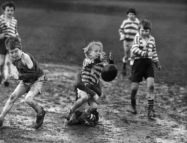 Children playing rugby in the mud 5th April 1972. When it comes to Rugby