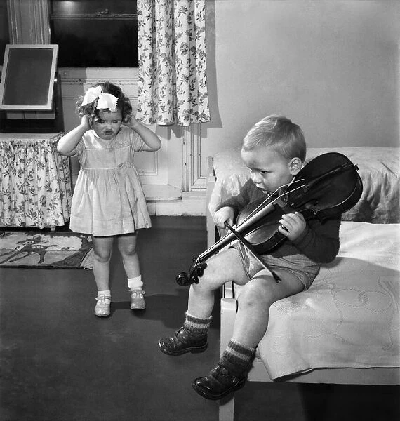 Children Playing with violin. March 1953 D1594
