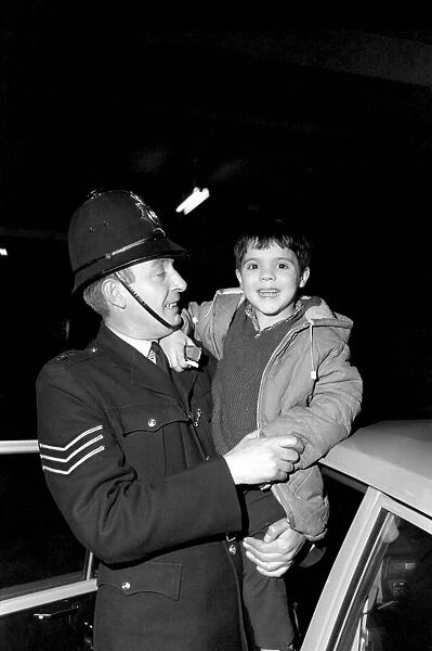 Children with policemen: A six year old boy who calls himself George Mason is