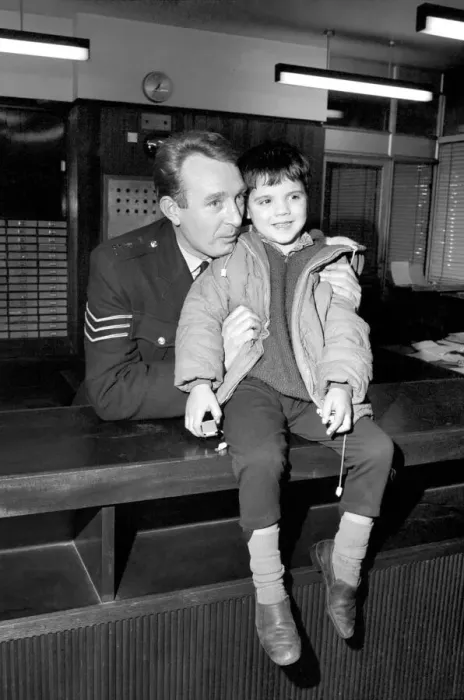 Framed Print : Children with policemen: A six year old boy who calls himself George Mason is Framed Print : Children with policemen: A six year old boy who calls himself George Mason is