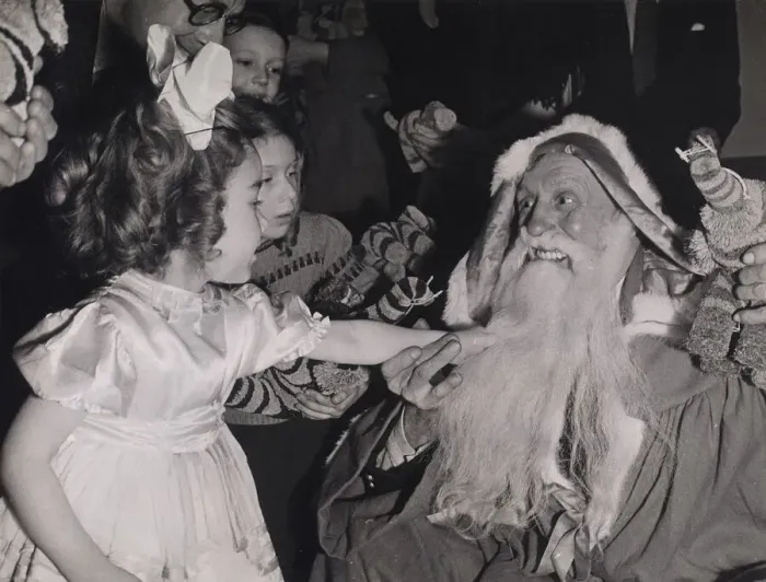 Framed Print : Children pulling Father Christmass beard at a party given by the Merchant Navy Club