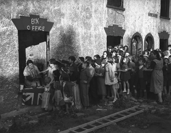 Framed Print : Children queue for show during London blitz The misery of the Blitz is partly alleviated Framed Print : Children queue for show during London blitz The misery of the Blitz is partly alleviated