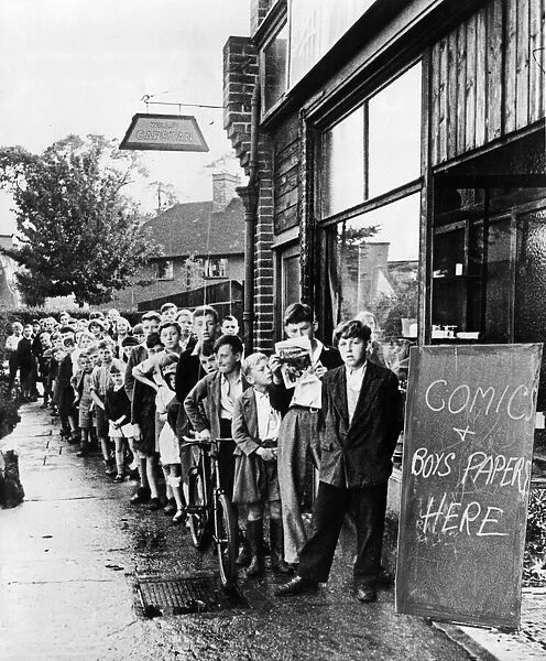 Children queue up outside a shop for comics in Eltham, London during World War Two