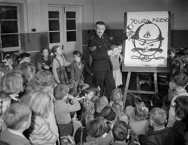 Children receiving a road safety lesson from a policeman during a class at school