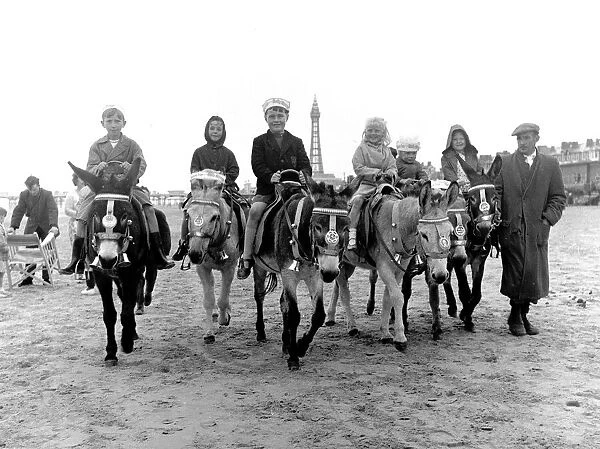 Children riding donkeys along the beach at Blackpool 5th August 1958