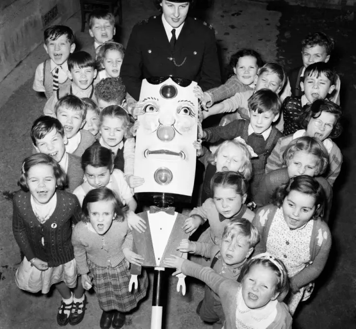 Framed Print : Children: Road safety a set of talking traffic lights teaches road safety to these infant