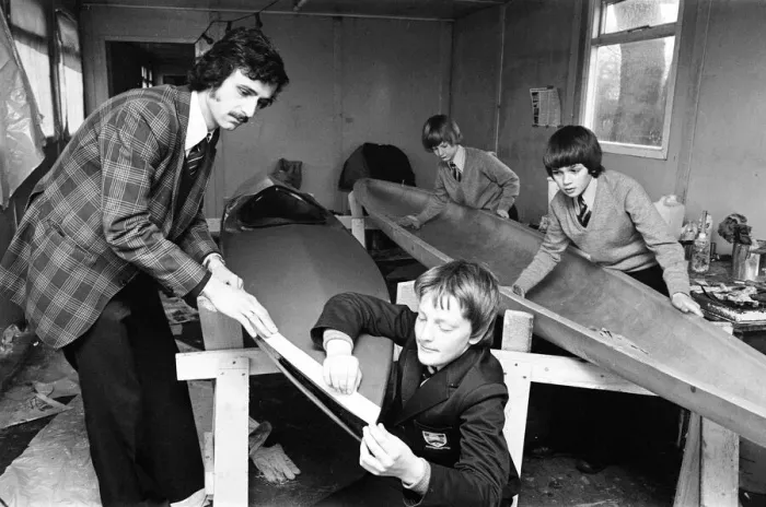 Framed Print : Children at Sarah Metcalfe School build a canoe in Wood shop class, Middlesbrough Framed Print : Children at Sarah Metcalfe School build a canoe in Wood shop class, Middlesbrough