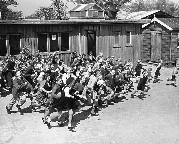 Children at school on the South East Coast of England, rush to their school shelter