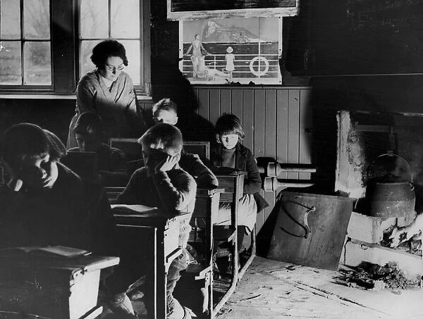 Children sitting at their desks in their school classroom on the Isle of Lewis in