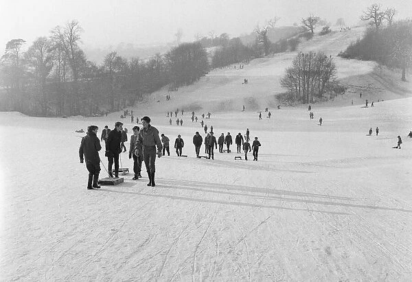 Children take the slopes of a Bristol park after a fresh fall of snow. 2nd January 1962