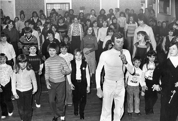 Children get in step with Garry Richardson in disco style