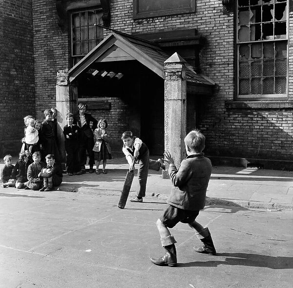 Children of Sunderland playing cricket in the back streets. 28th April 1954