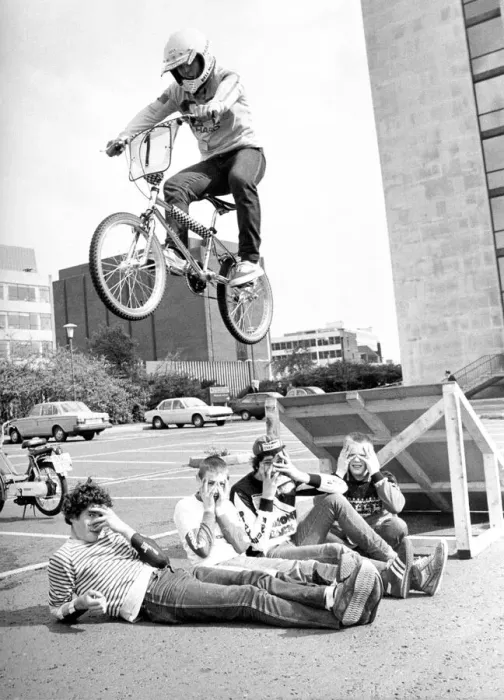 Framed Print : These children can t look while a BMX rider jumps over them in a stunt at Bike Rite Framed Print : These children can t look while a BMX rider jumps over them in a stunt at Bike Rite