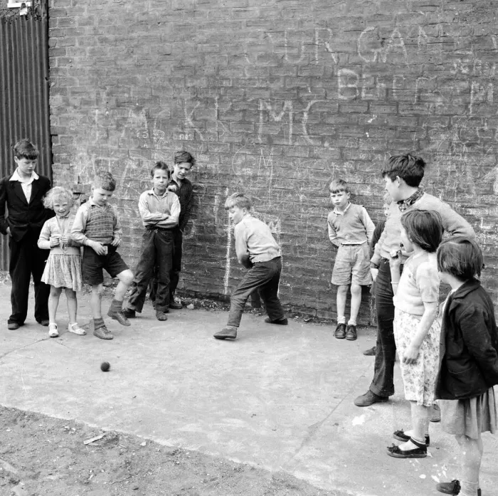 Framed Print : Children of the tenement blocks of Govan, Glasgow seen here playing a game of street Framed Print : Children of the tenement blocks of Govan, Glasgow seen here playing a game of street