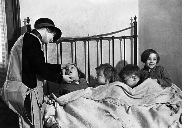 Children tucked up in bed at a Salvation Army place. July 1935 P012170