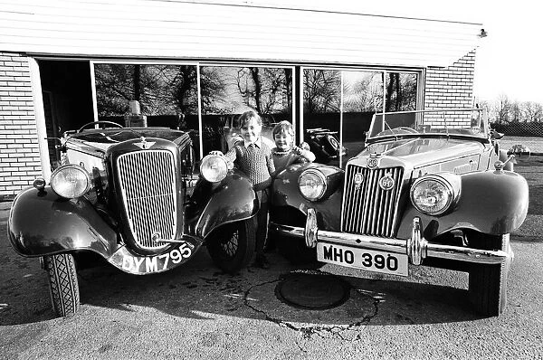 Children with vintage Austin and MG cars. 21st January 1975