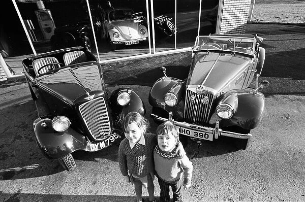 Children with vintage Austin and MG cars. 21st January 1975