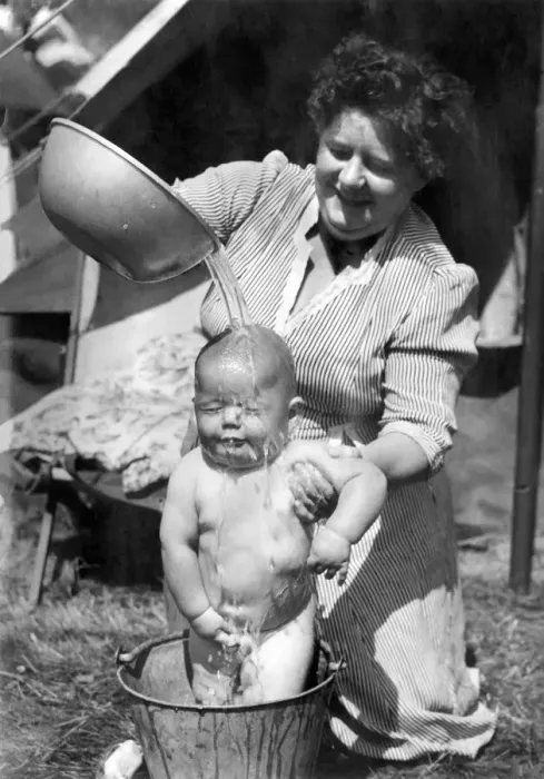 Framed Print : Children: Washing: Mrs. Ann Farrier gives her son 8 months old John his morning bath in a