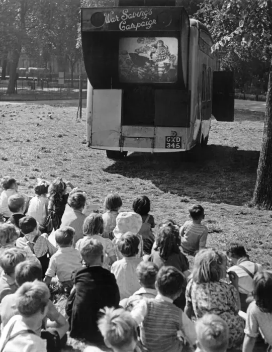 Framed Print : Children watch an open air cinema performance of Ralph Readers Gang Show Framed Print : Children watch an open air cinema performance of Ralph Readers Gang Show