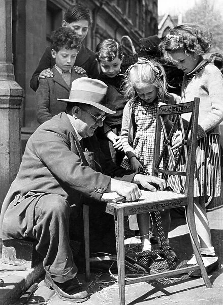 Some of the children watching are evacuees from Gibraltar. April 1943 P004942