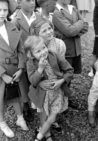 Children watching the Punch and Judy Show on the beach Circa 1935 Children