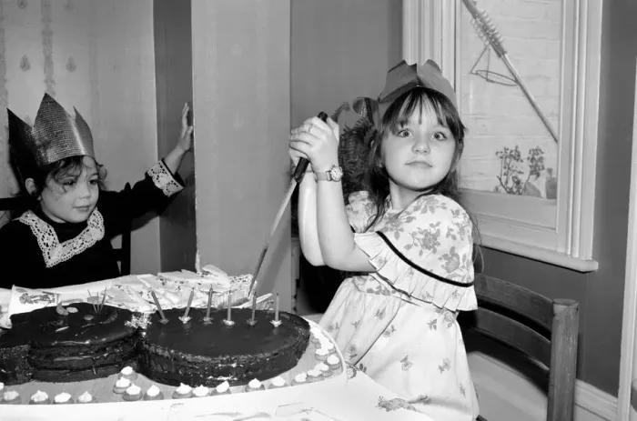 Framed Print : Childrens birthday party: The birthday girl cuts the cake. March 1981 PM 81-01186b-001