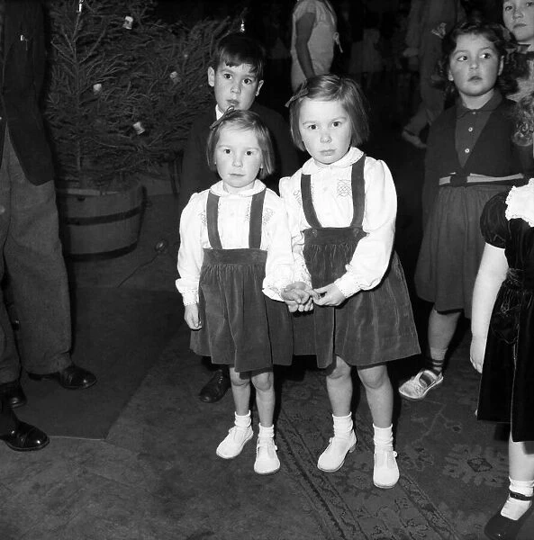 Childrens Christmas Party. Two little girls December 1952 C6342-006