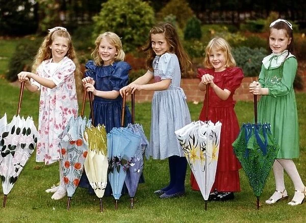 Childrens clothing and fashion Five young girls model matching dresses