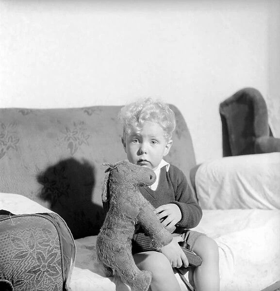 Childrens Expressions: Kenneth Knowles of Manchester seen here at home looking glum