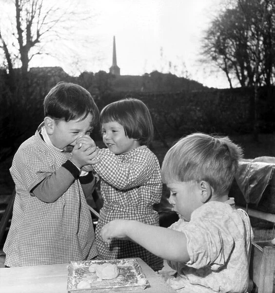Childrens playing with putty. November 1953 D6729-001