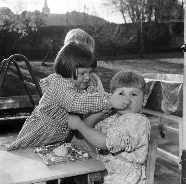Childrens playing with putty. November 1953 D6729
