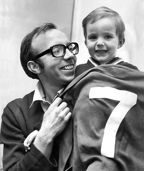 Childs play... Nobby Stiles shows son Peter, aged 2 1  /  2