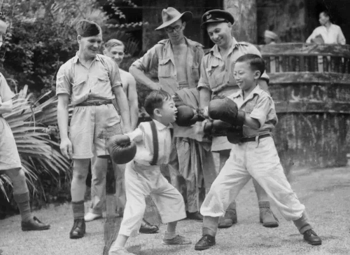 Framed Print : Chinese children taken under the wing of RAF officers having a boxing fight in Hong Kong