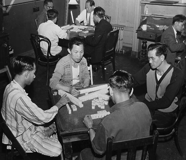 Chinese seamen playing mahjong in a seamens hostel in Liverpool, 2nd August 1962