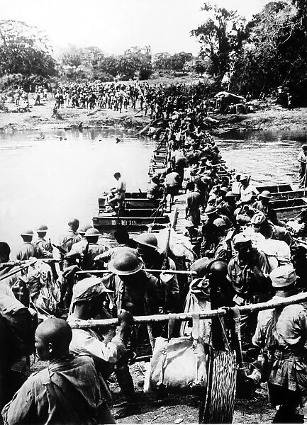 US and Chinese troops constructing a bridge out of shallow boats