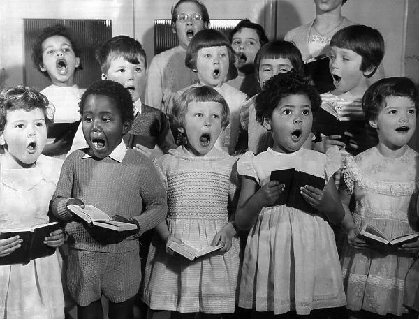 A choir of children sing at the Dr Barnados Farm Hill in Kelvedon Essex