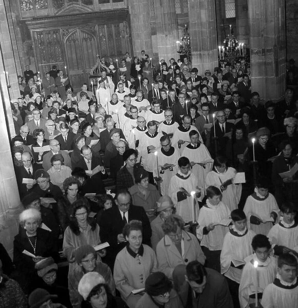 The choir and clergy of Holy Trinity Church, Coventry, walking down the aisle towards