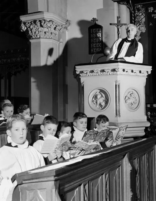 Framed Print : Choirboys reading their books in church during a priests sermon Circa 1954 Framed Print : Choirboys reading their books in church during a priests sermon Circa 1954