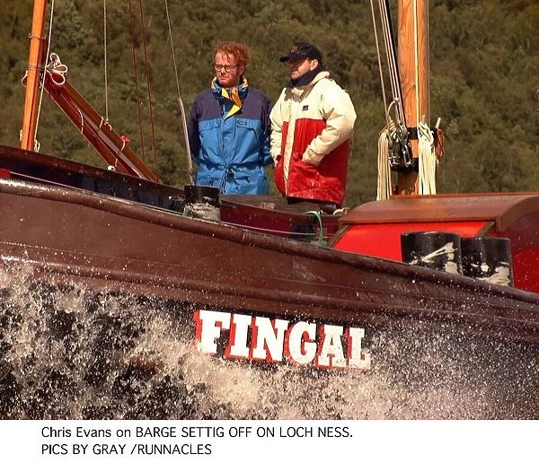 Chris Evans Radio one dj and tv presenter on a barge with a unknown male on Loch Ness