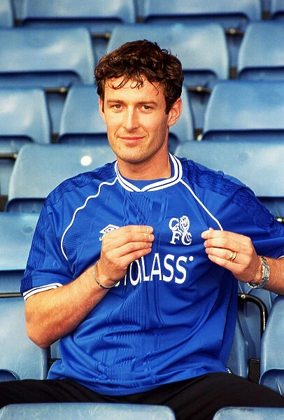 Chris Sutton, poses for the media during a photocall at Stamford Bridge after signing a